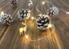 MagicHome, Karácsonyi Füzér, 20x meleg fehér LED, havas tobozokkal, 2xAA